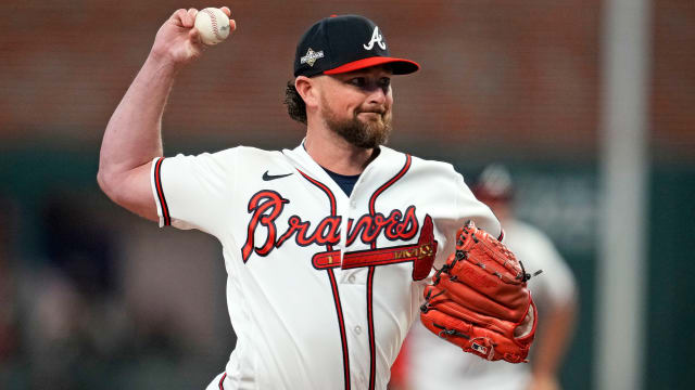 Oct 9, 2023; Cumberland, Georgia, USA; Atlanta Braves relief pitcher Kirby Yates (22) pitches during the fifth inning against the Philadelphia Phillies in game two of the NLDS for the 2023 MLB playoffs at Truist Park.